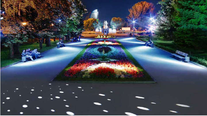 En park som er pent belyst med Philips Lighting