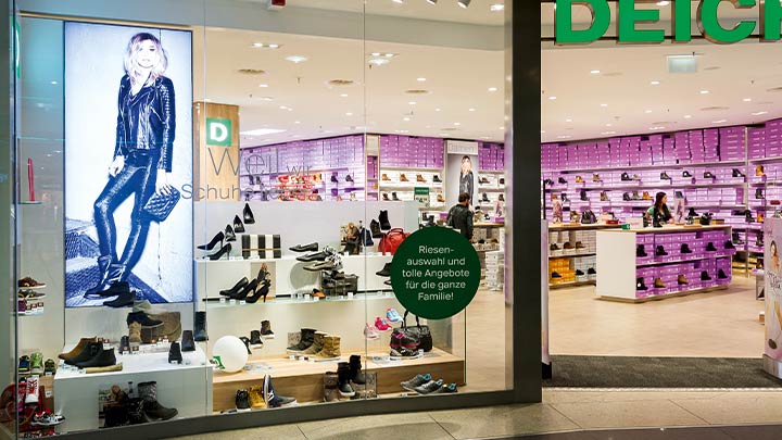 Et lyst butikkvindu trekker kunder inn i butikken